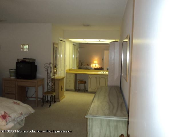 314 Cedar Key Circle Atlantis, FL 33462 - Photo 15 of 23 a bathroom with a sink a toilet and mirror