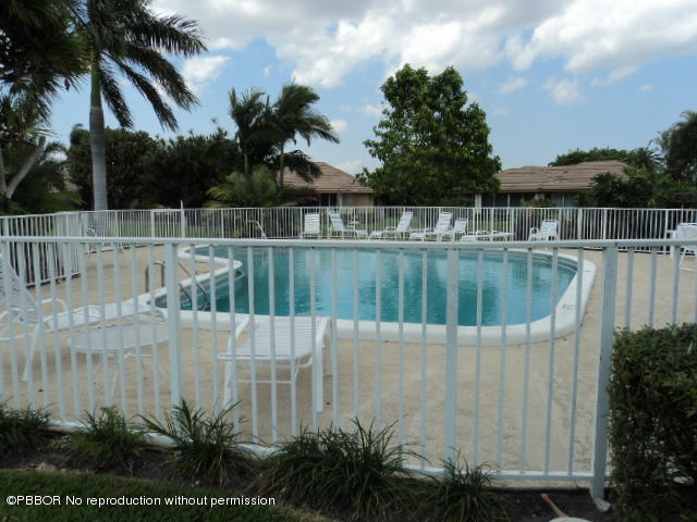 314 Cedar Key Circle Atlantis, FL 33462 - Photo 22 of 23 a view of outdoor space with swimming pool and lake view