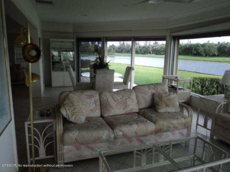 314 Cedar Key Circle Atlantis, FL 33462 - Photo 7 of 23 a living room with furniture and garden view