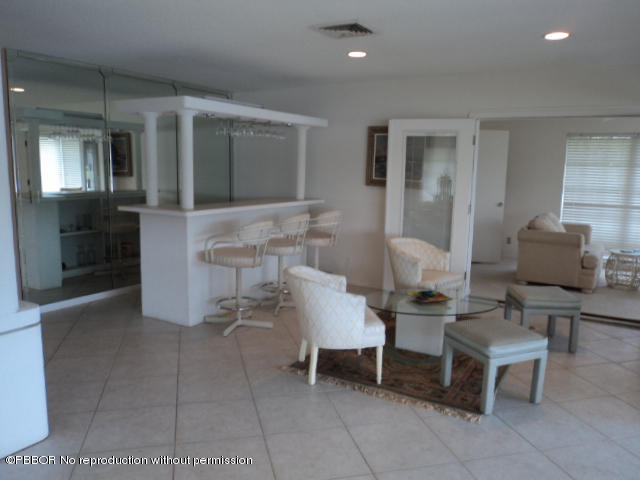 314 Cedar Key Circle Atlantis, FL 33462 - Photo 9 of 23 a living room with furniture and a lamp