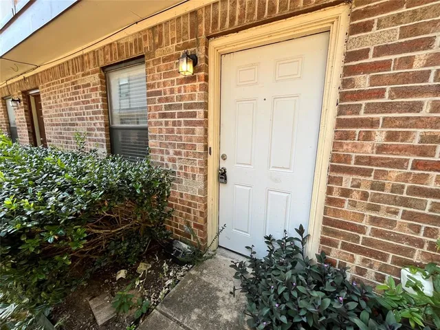 a view of a livingroom with wooden floor and a ceiling fan