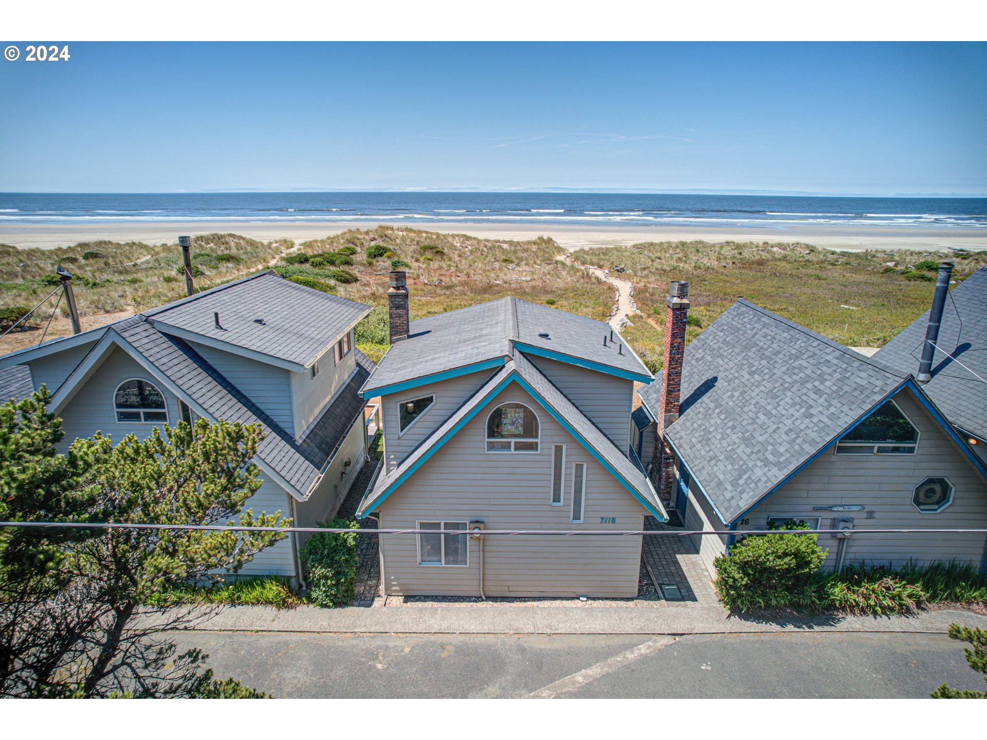 an aerial view of house with ocean view