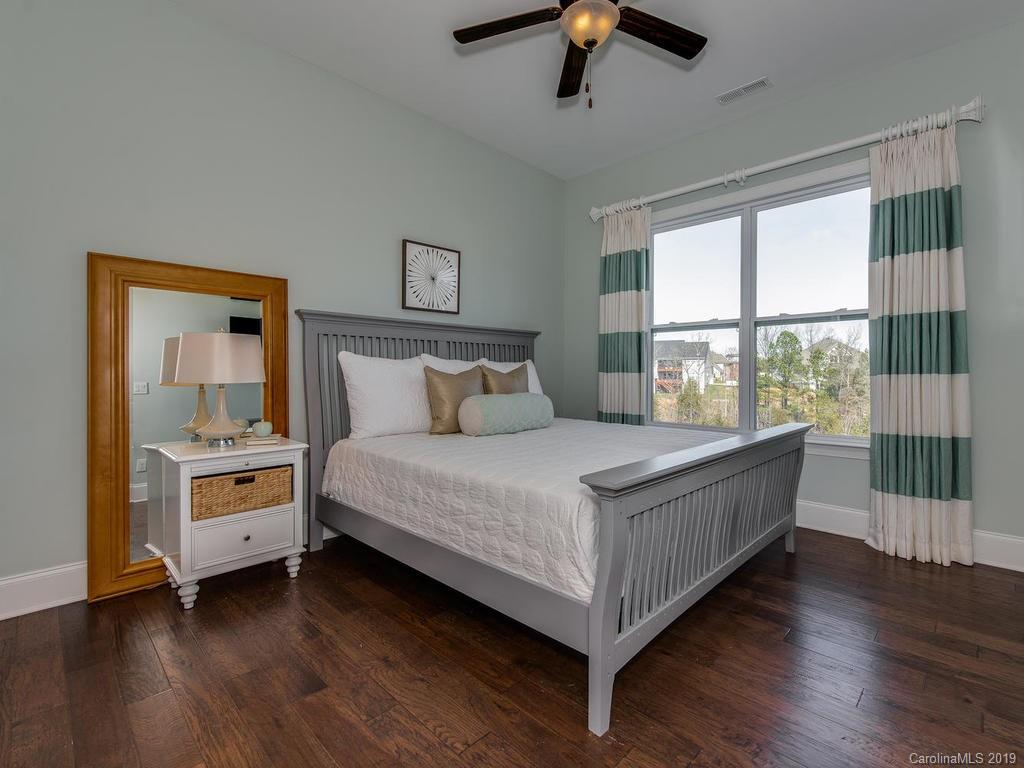 2116 Stratton Place Fort Mill, SC 29708 - Photo 14 of 35 a bedroom with a bed and large window