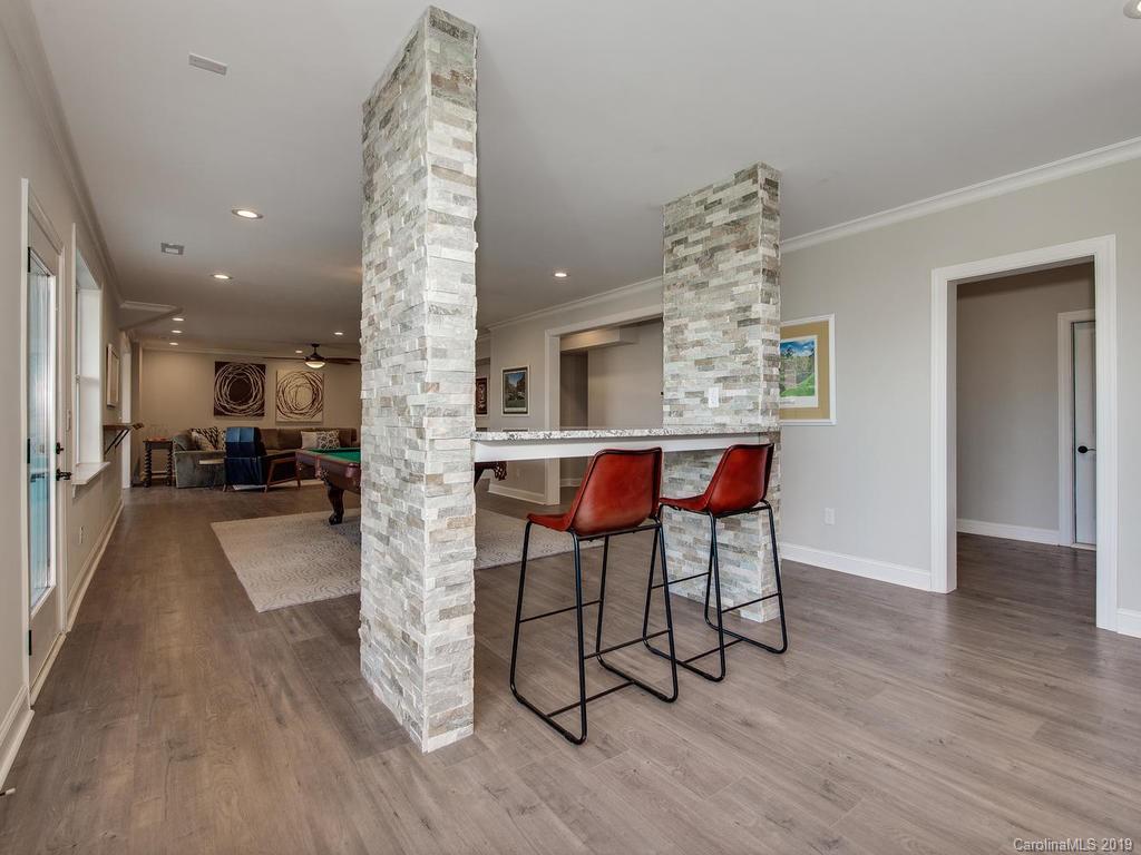 2116 Stratton Place Fort Mill, SC 29708 - Photo 22 of 35 a view of a dining room with furniture and wooden floor
