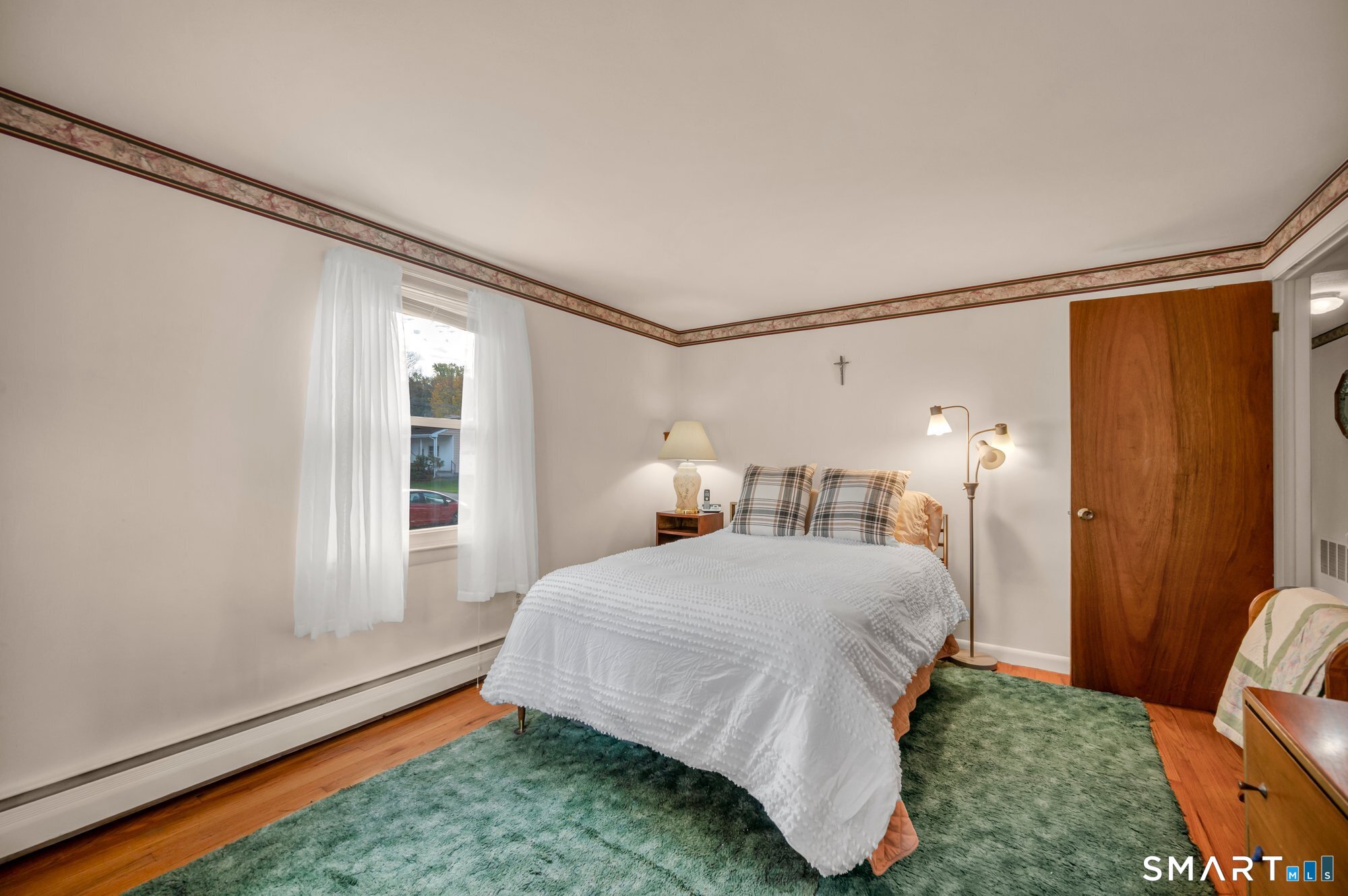 85 Florence Street Newington, CT 06111 - Photo 11 of 26 a bedroom with a bed and a window