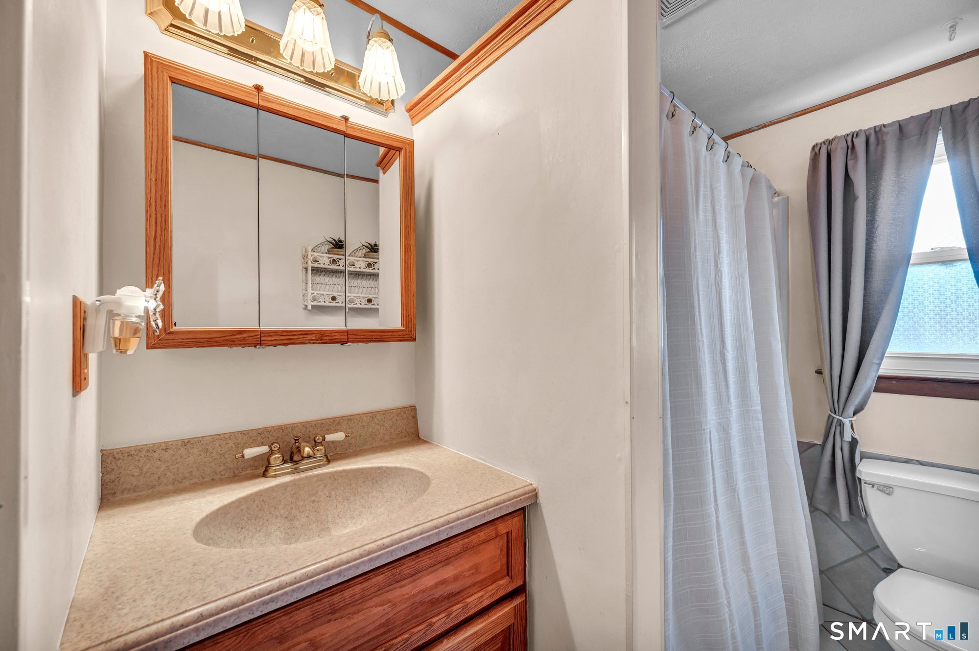 85 Florence Street Newington, CT 06111 - Photo 17 of 26 a bathroom with a sink toilet and shower
