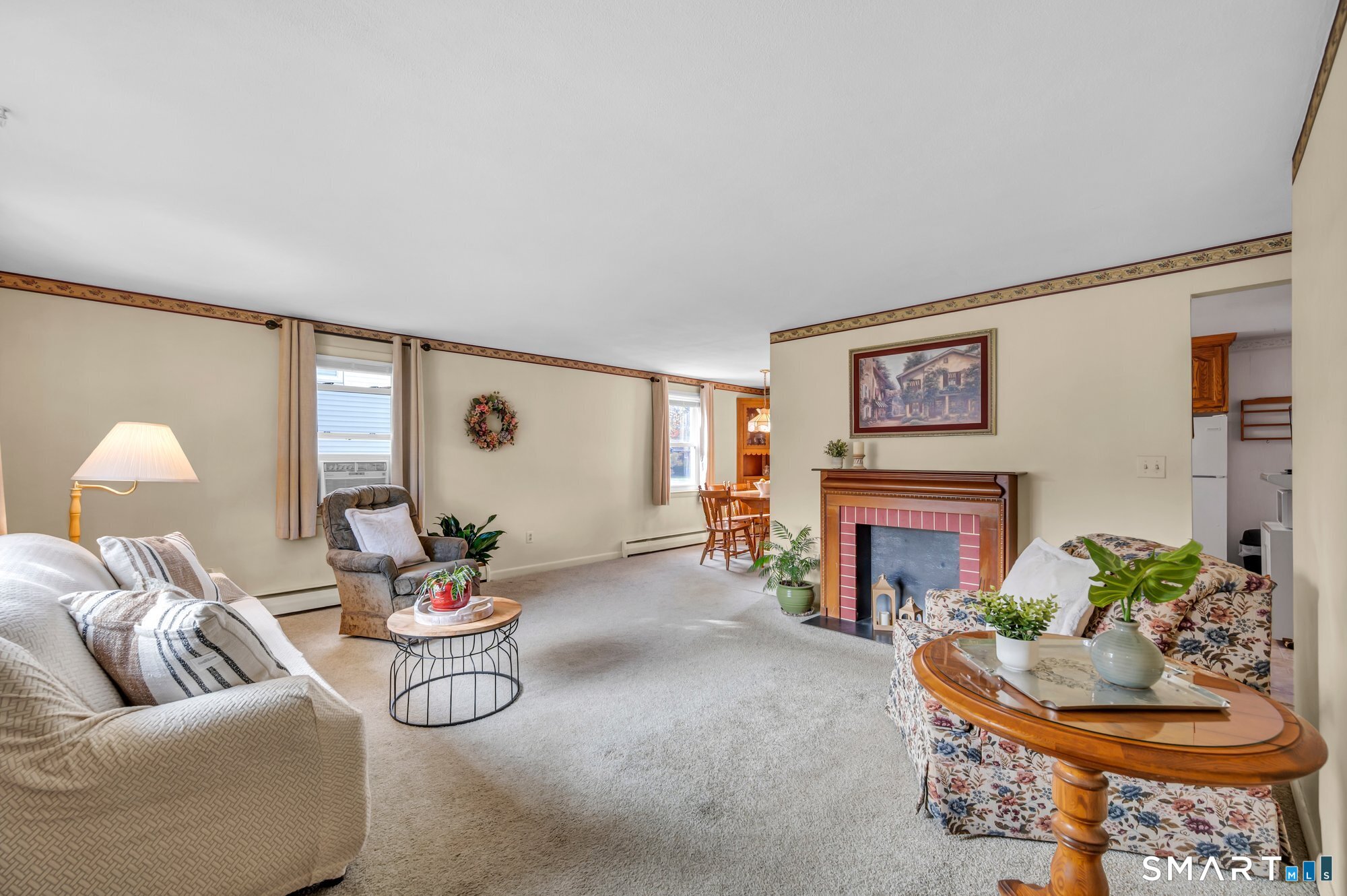 85 Florence Street Newington, CT 06111 - Photo 2 of 26 a living room with furniture and a fireplace