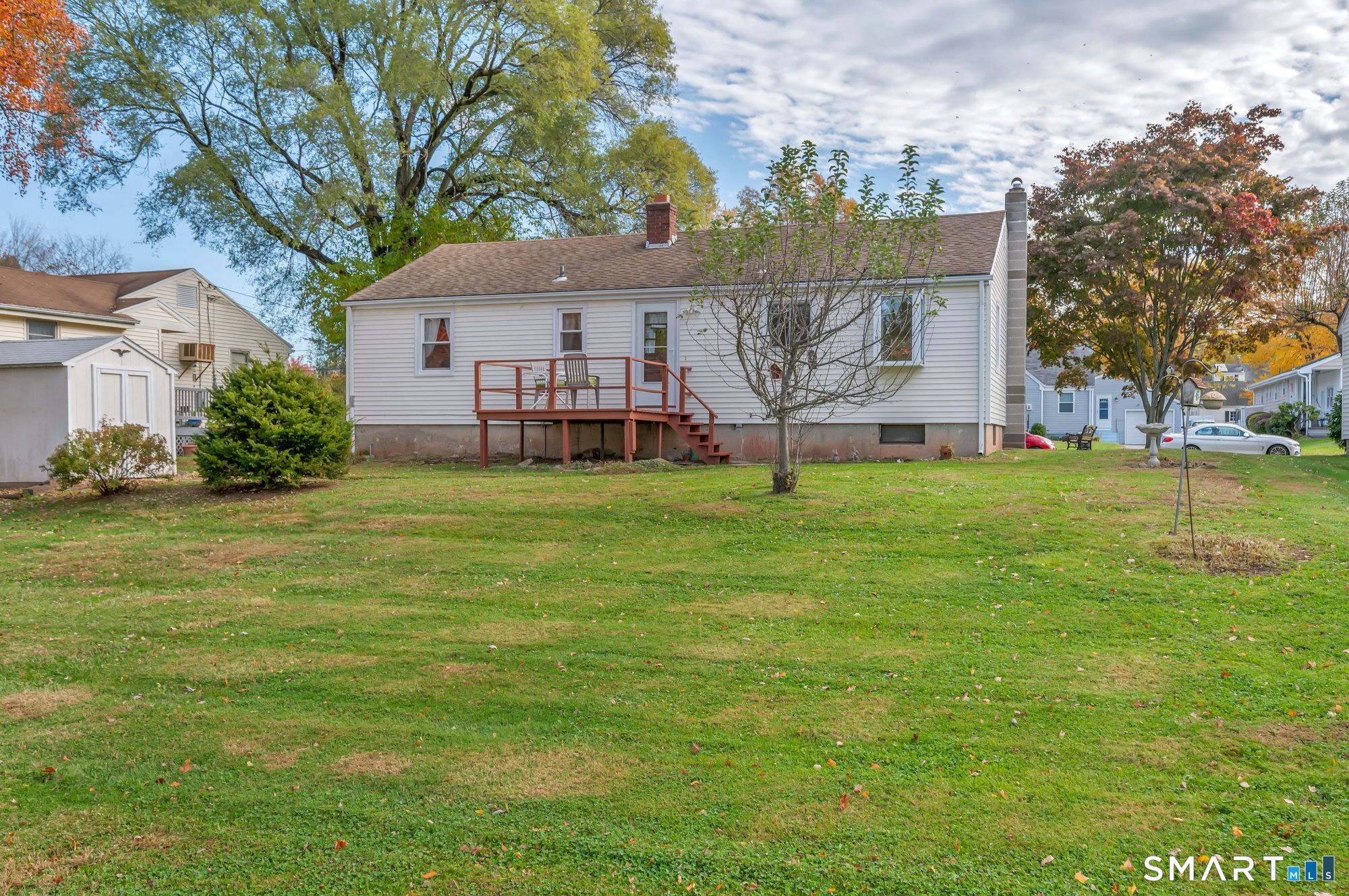 85 Florence Street Newington, CT 06111 - Photo 21 of 26 a view of a house with a big yard potted plants and large tree