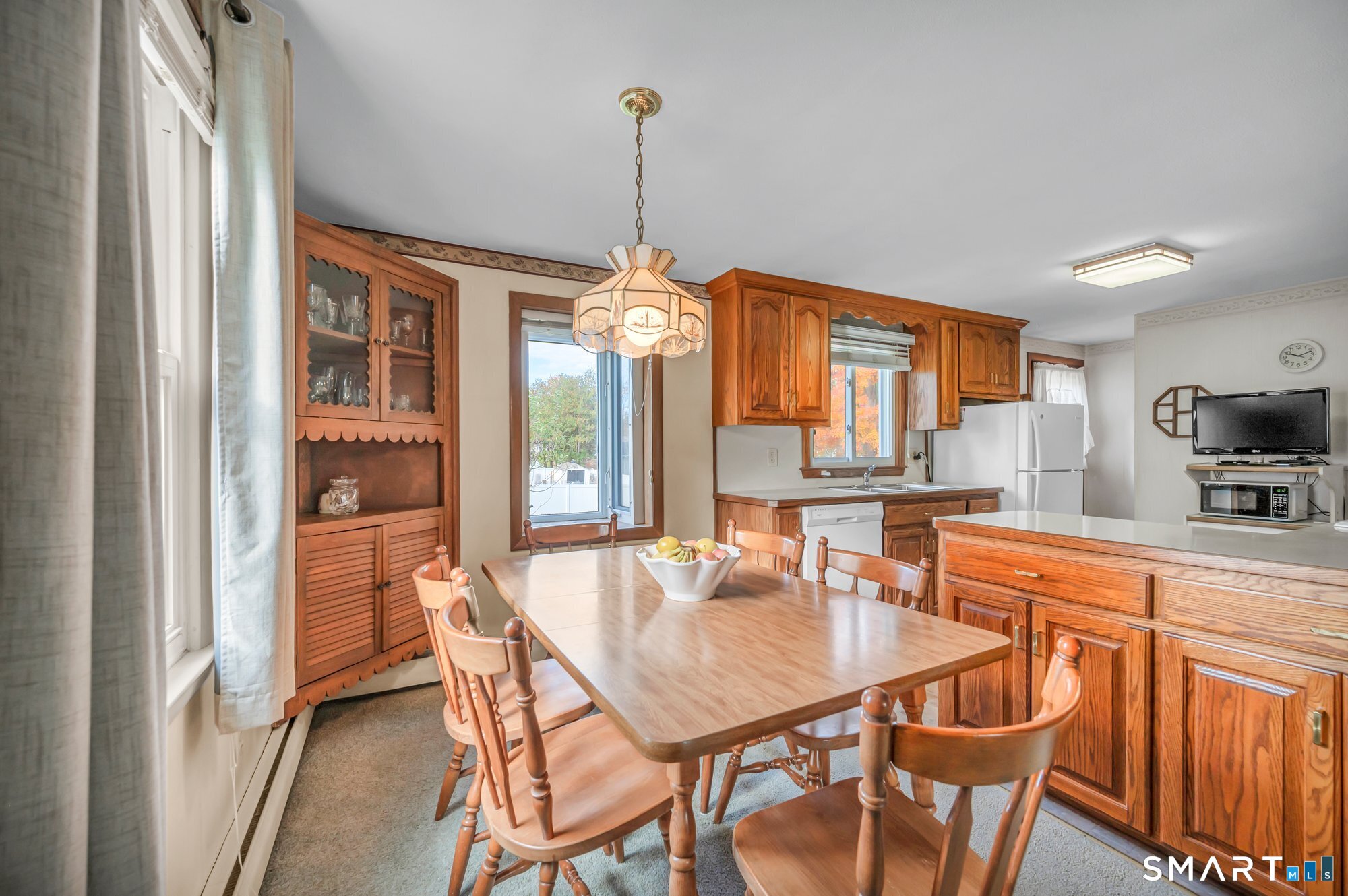 85 Florence Street Newington, CT 06111 - Photo 6 of 26 a dining room filled chandelier and wooden floor
