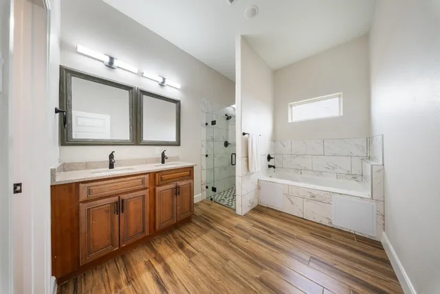 a bathroom with a sink and shower