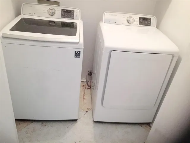 a utility room with dryer and washer