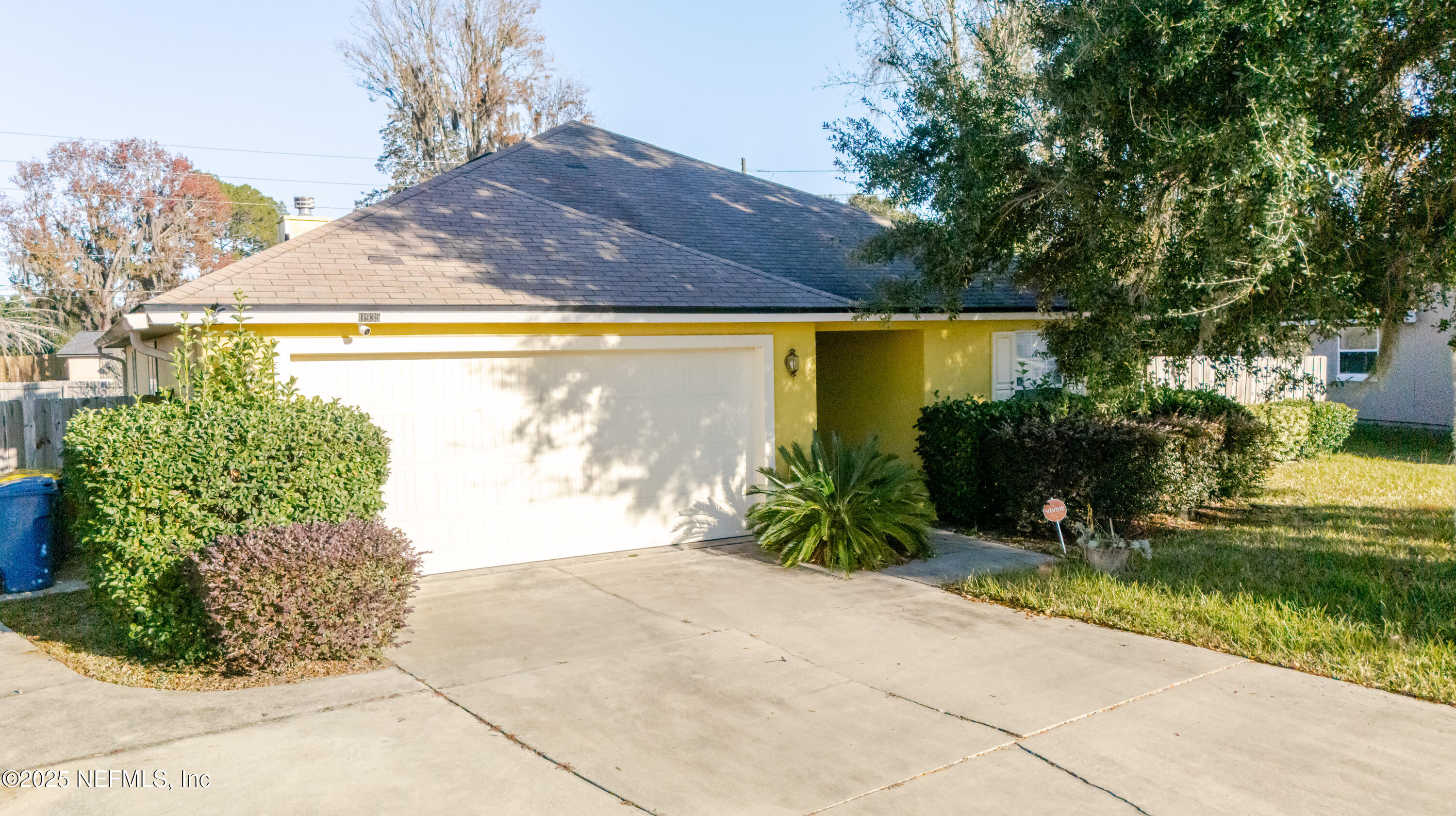 a front view of a house with a yard and an outdoor seating