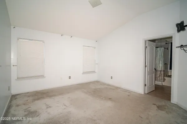 an empty room with windows