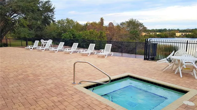 a view of a patio with a table chairs and a couple of chairs