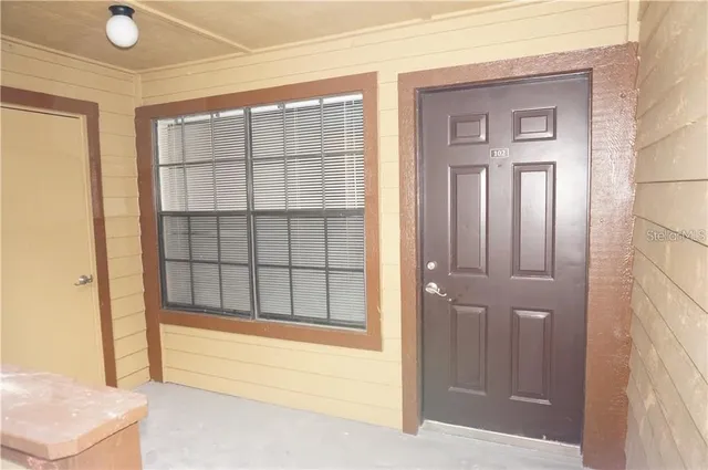 a view of an empty room with a window