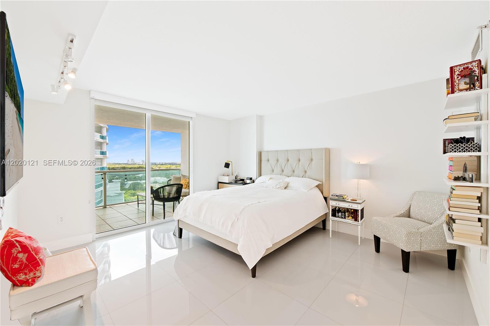 2101 Brickell Avenue, Unit 1909 Miami, FL 33129 - Photo 12 of 25 a bedroom with a bed and a couch