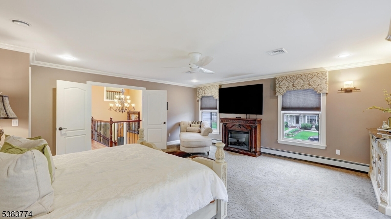 820 Rhine Boulevard Raritan, NJ 08869 - Photo 18 of 47 a bedroom with a bed and a flat screen tv