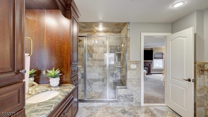 820 Rhine Boulevard Raritan, NJ 08869 - Photo 22 of 47 a bathroom with a granite countertop shower a mirror and vanity
