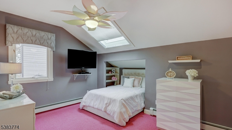 820 Rhine Boulevard Raritan, NJ 08869 - Photo 23 of 47 a spacious bedroom with a bed and a flat screen tv