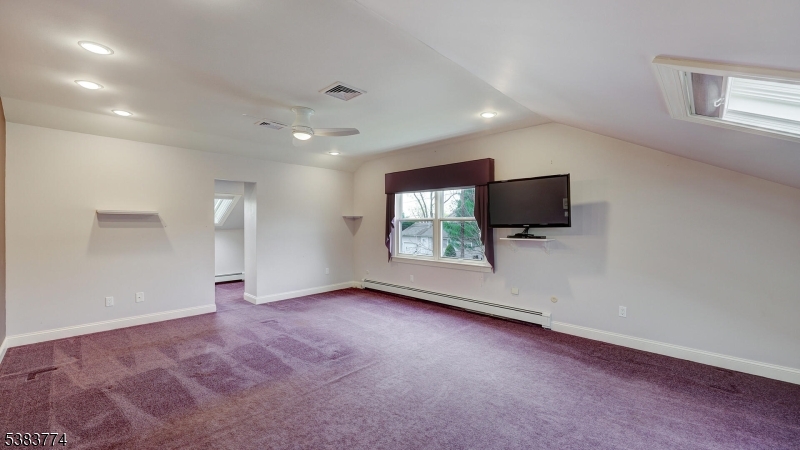 820 Rhine Boulevard Raritan, NJ 08869 - Photo 25 of 47 an empty room with a flat screen tv and a window