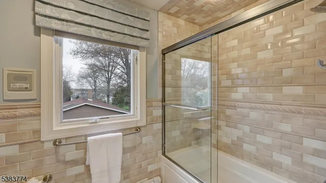 a bathroom with a glass shower door