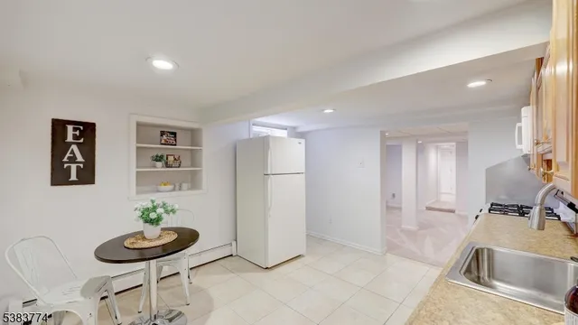 a view of a livingroom with furniture and lounge chair