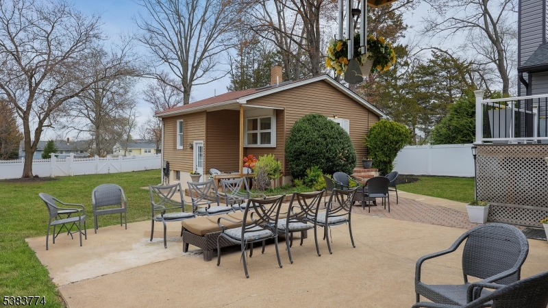 820 Rhine Boulevard Raritan, NJ 08869 - Photo 36 of 47 a view of a patio with couches table and chairs and potted plants