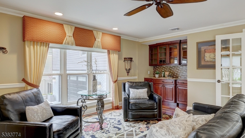 820 Rhine Boulevard Raritan, NJ 08869 - Photo 7 of 47 a living room with furniture and a flat screen tv