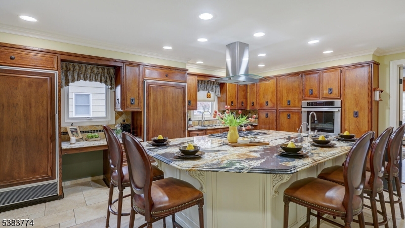 820 Rhine Boulevard Raritan, NJ 08869 - Photo 9 of 47 a kitchen with sink a refrigerator and chairs