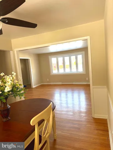 a view of room with window and wooden floor
