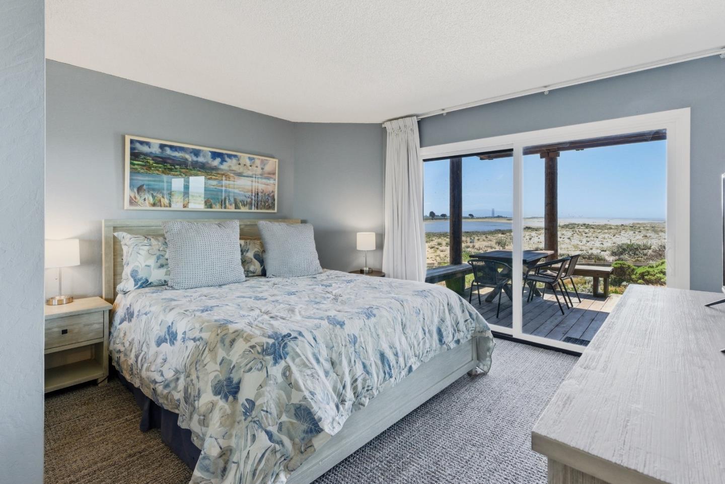 2661 Beach Road, Unit P75 Watsonville, CA 95076 - Photo 12 of 28 a spacious bedroom with a bed and large windows