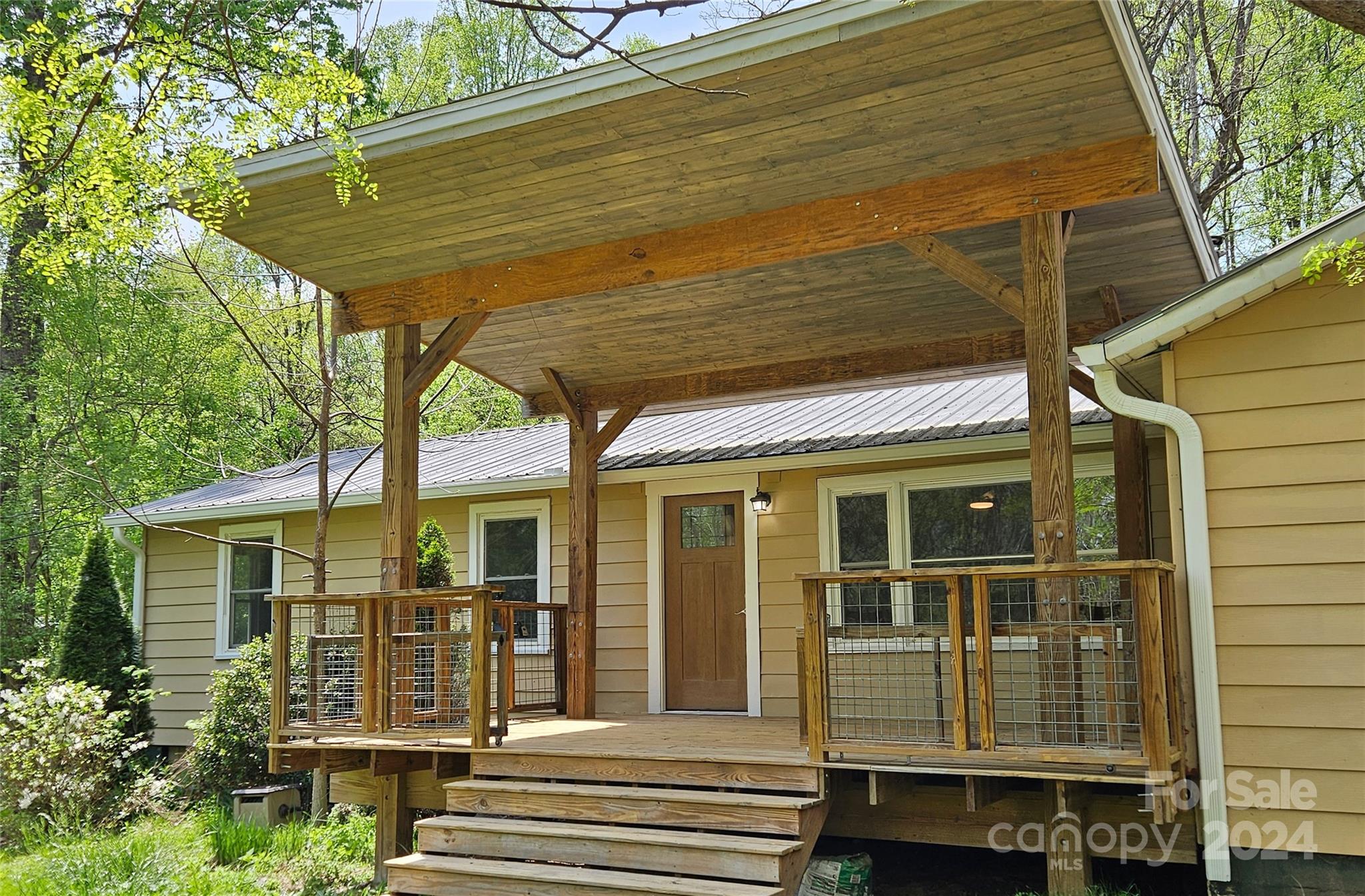 a front view of a house with a porch