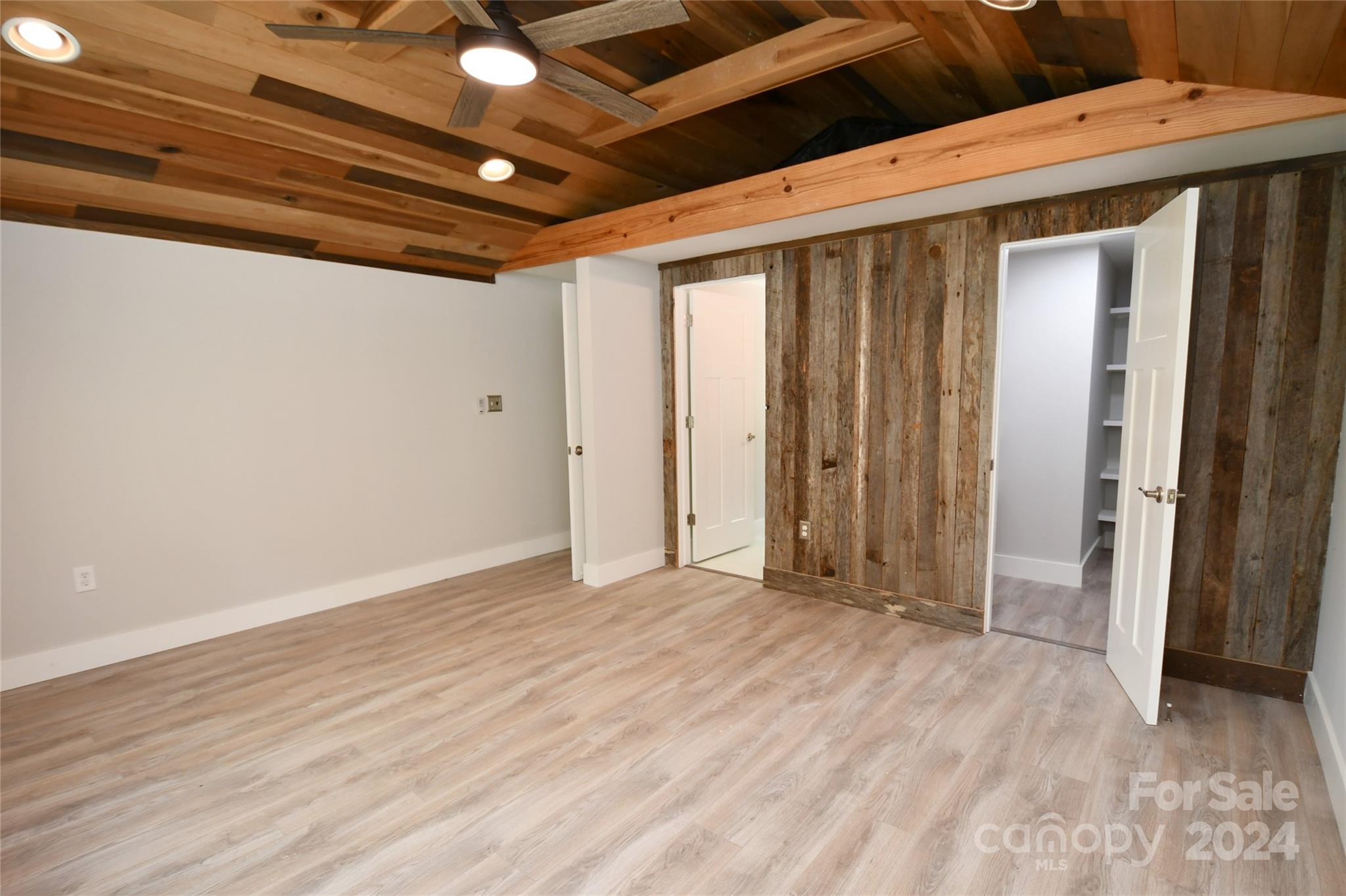 18 Rocky Slope Road Asheville, NC 28804 - Photo 13 of 41 a view of a room with wooden floor and a ceiling fan