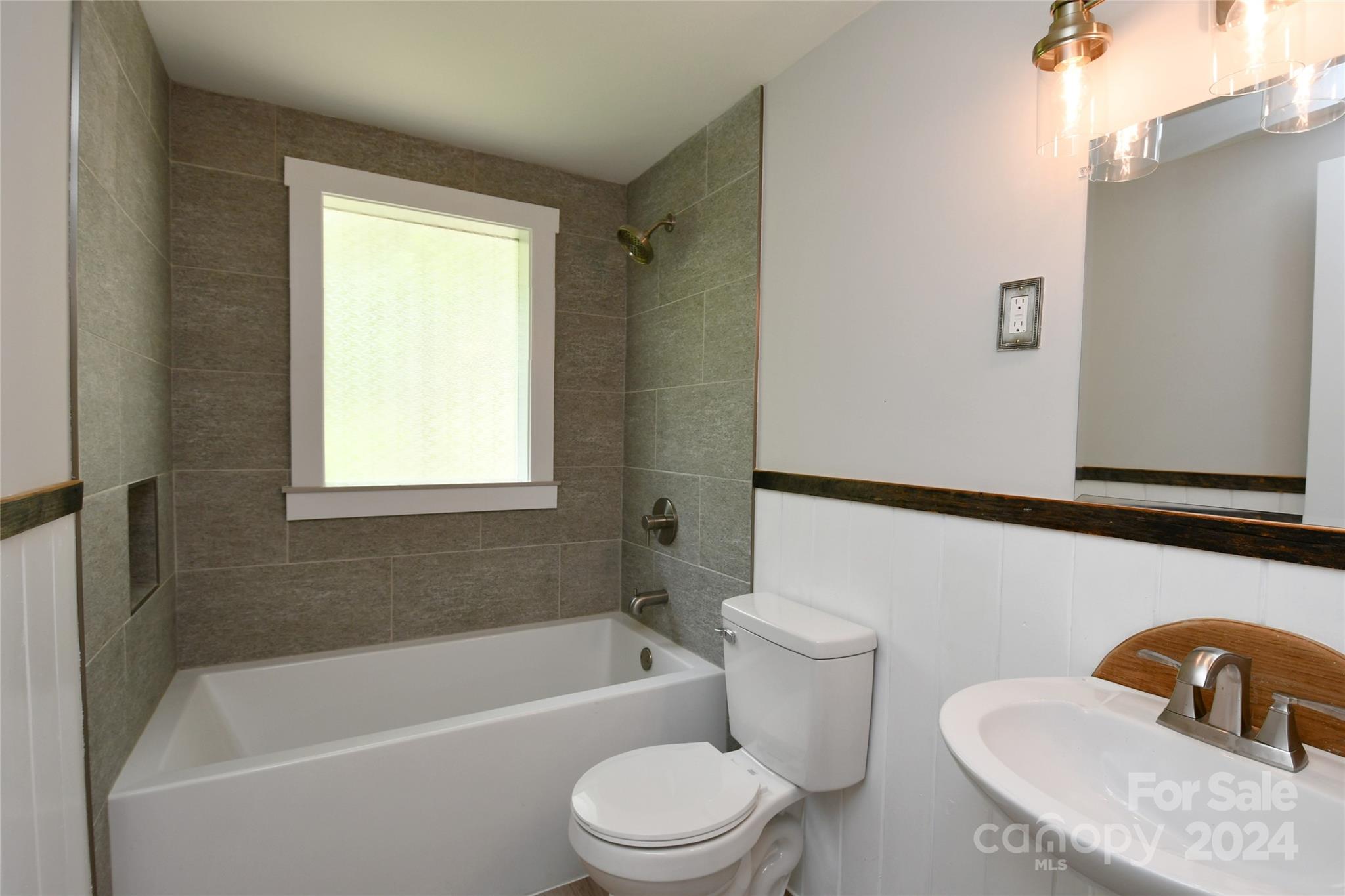 18 Rocky Slope Road Asheville, NC 28804 - Photo 22 of 41 a bathroom with a sink toilet and shower