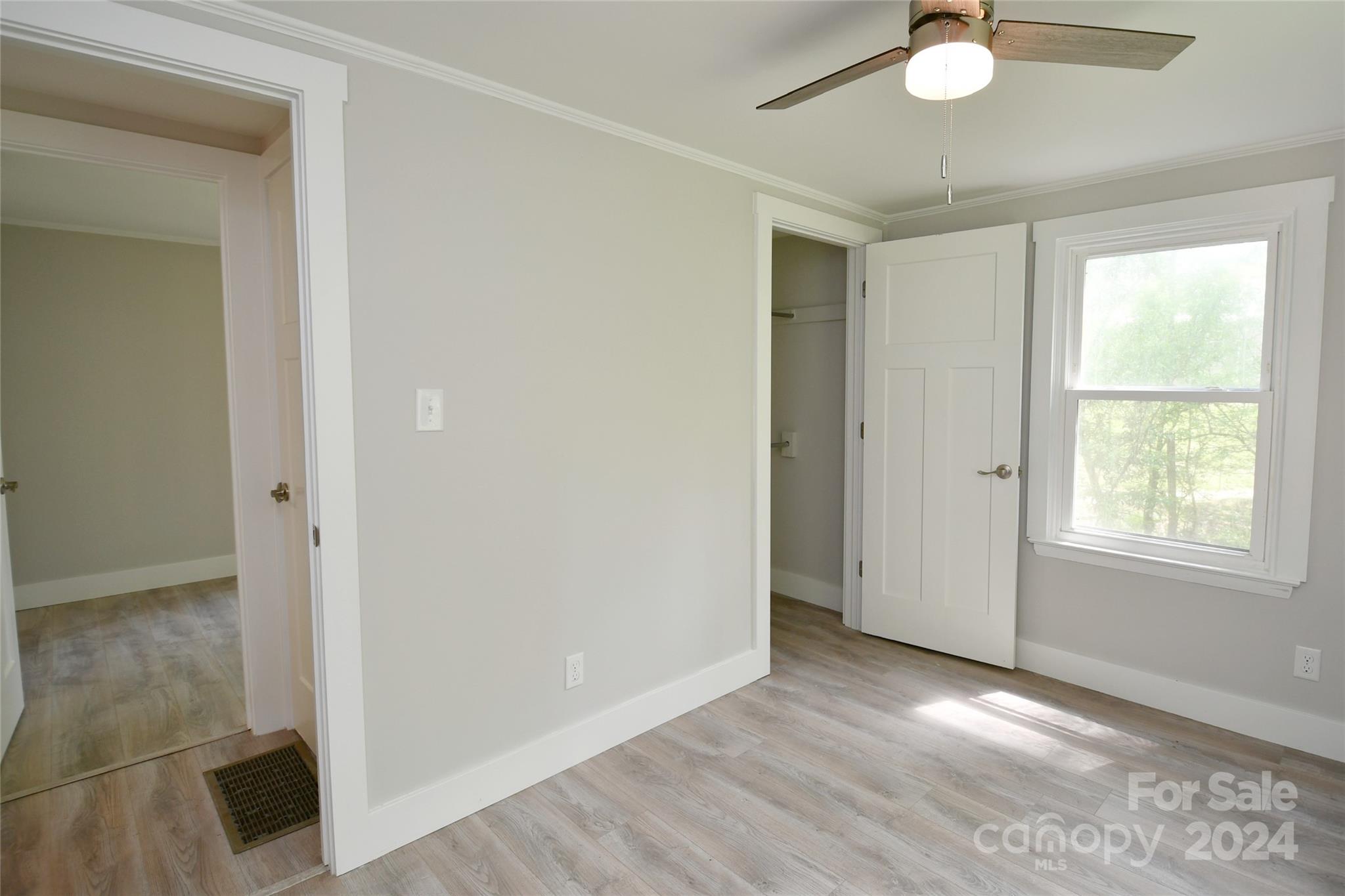 18 Rocky Slope Road Asheville, NC 28804 - Photo 23 of 41 an empty room with wooden floor cabinet and windows