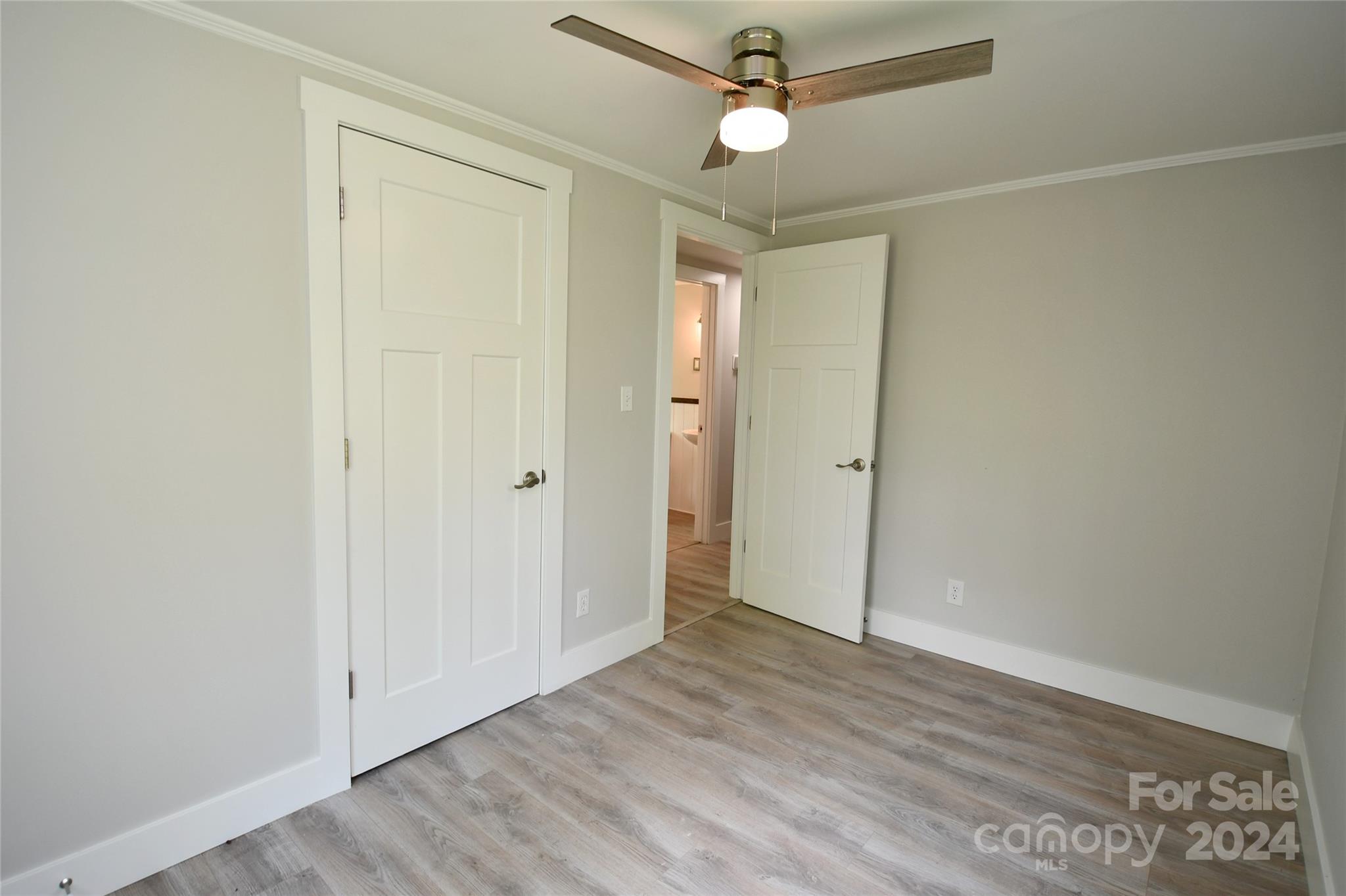 18 Rocky Slope Road Asheville, NC 28804 - Photo 24 of 41 an empty room with wooden floor and windows