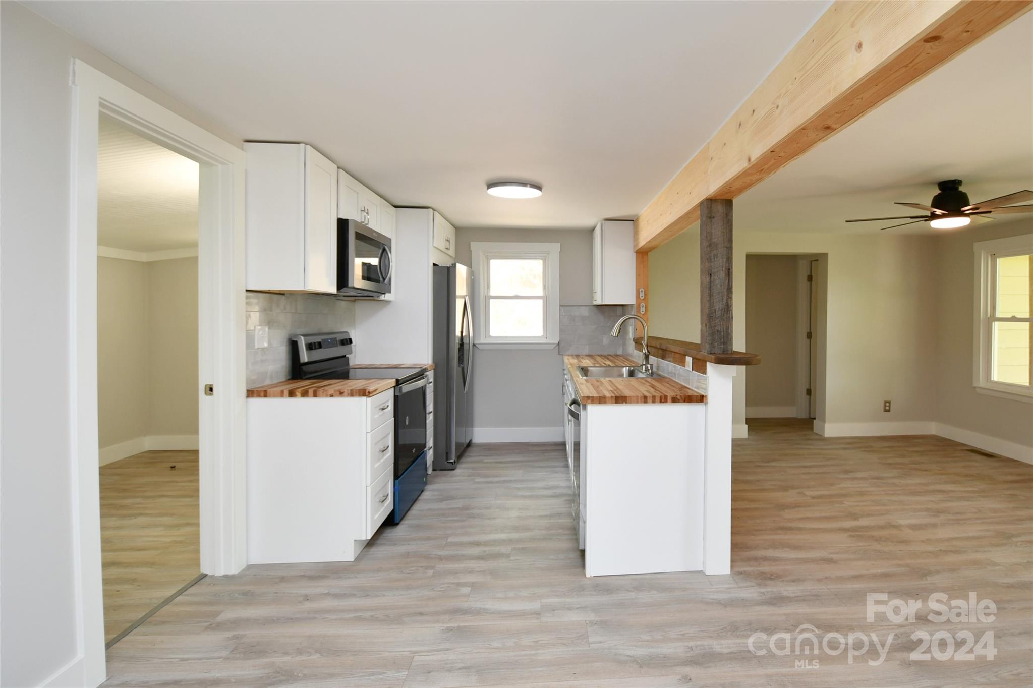 18 Rocky Slope Road Asheville, NC 28804 - Photo 6 of 41 a kitchen with a refrigerator and a sink