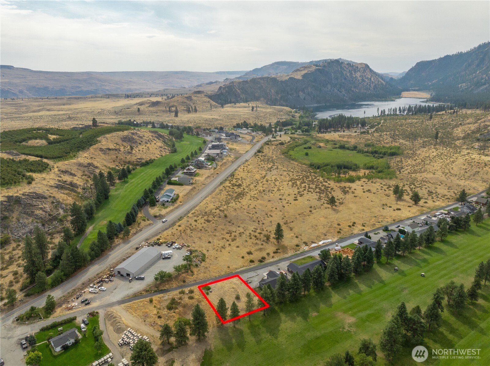 103 Golf Course Drive Pateros, WA 98846 - Photo 2 of 24 a view of a lake with a mountain