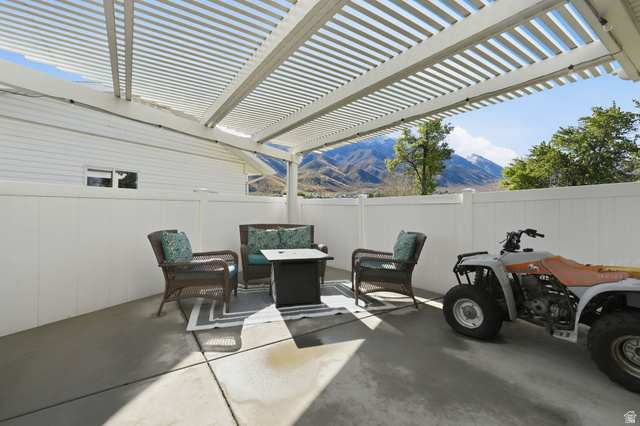 415 East 400 North Santaquin, UT 84655 - Photo 28 of 39 Paved patio with an open lattice pergola and perimeter fencing