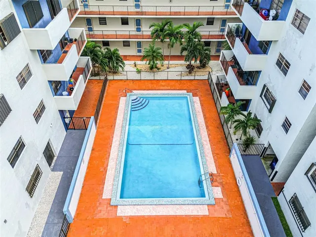 a kitchen with a sink stove and refrigerator