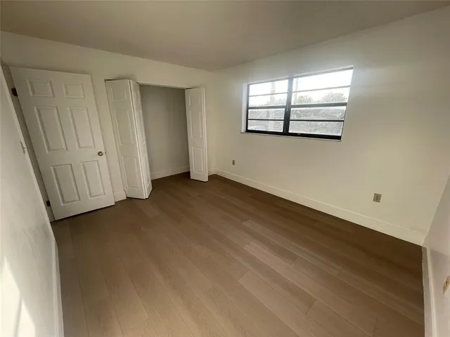 a bathroom with a shower a toilet and a shower