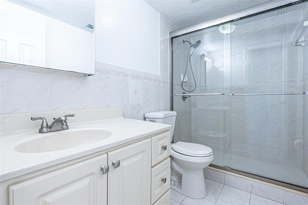 1470 West 41st Street, Unit 201 Hialeah, FL 33012 - Photo 12 of 26 a bathroom with a sink toilet and shower