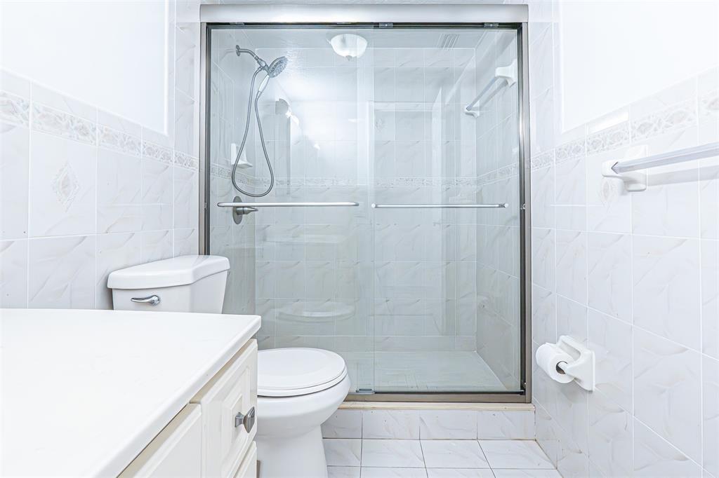 1470 West 41st Street, Unit 201 Hialeah, FL 33012 - Photo 13 of 26 a bathroom with a shower a toilet and a shower