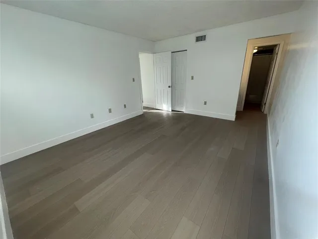 a balcony with wooden floor