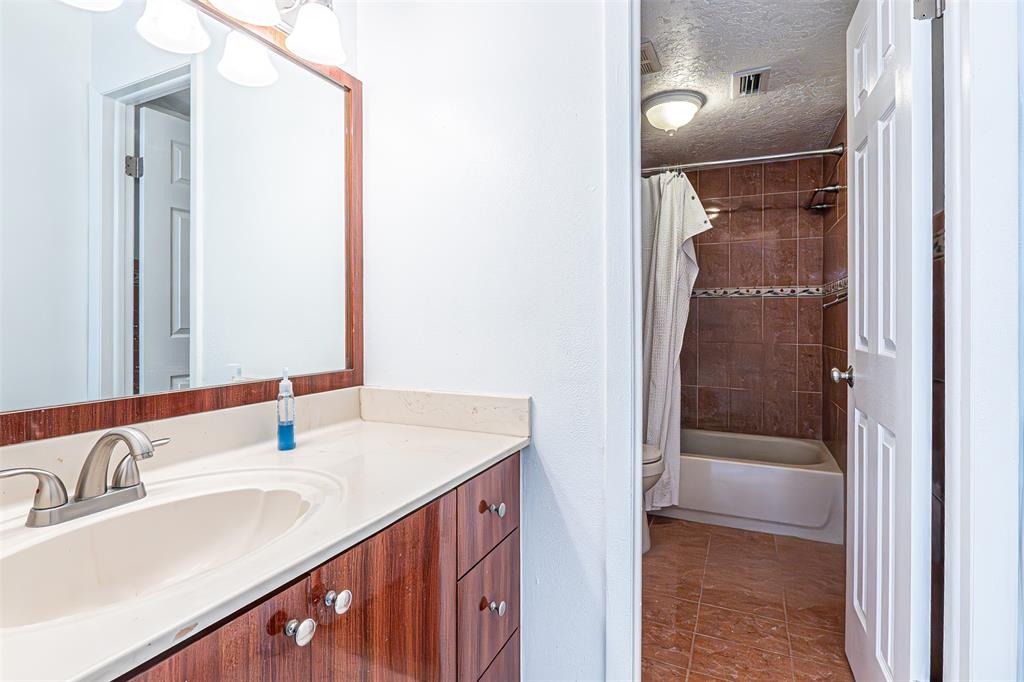 1470 West 41st Street, Unit 201 Hialeah, FL 33012 - Photo 20 of 26 a bathroom with a sink and a mirror