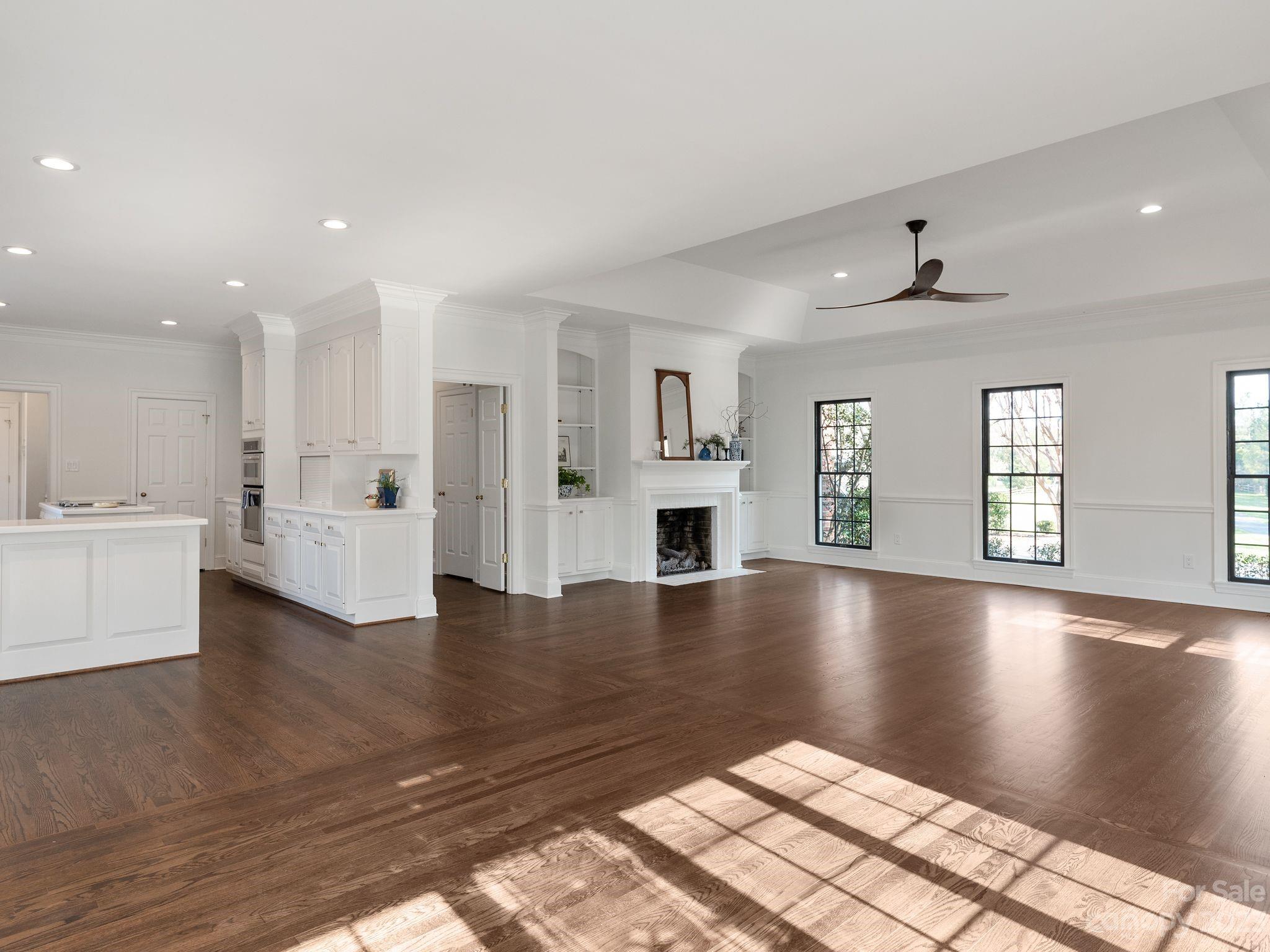 1150 Concord Road Davidson, NC 28036 - Photo 11 of 39 a view of an empty room with window and wooden floor
