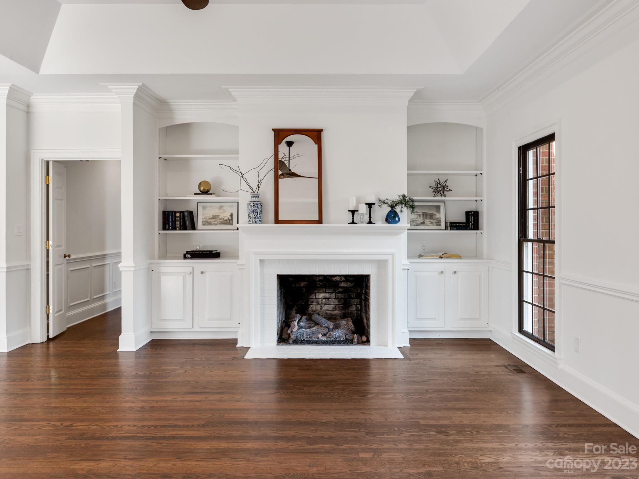 1150 Concord Road Davidson, NC 28036 - Photo 12 of 39 a living room with stainless steel appliances hardwood floor and a fireplace