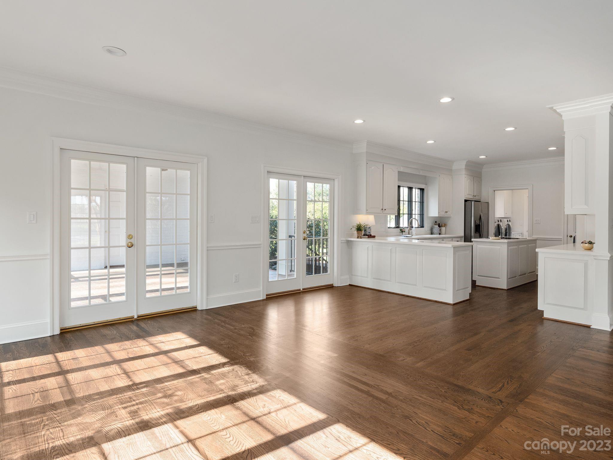 1150 Concord Road Davidson, NC 28036 - Photo 16 of 39 a view of an empty room with window and wooden floor