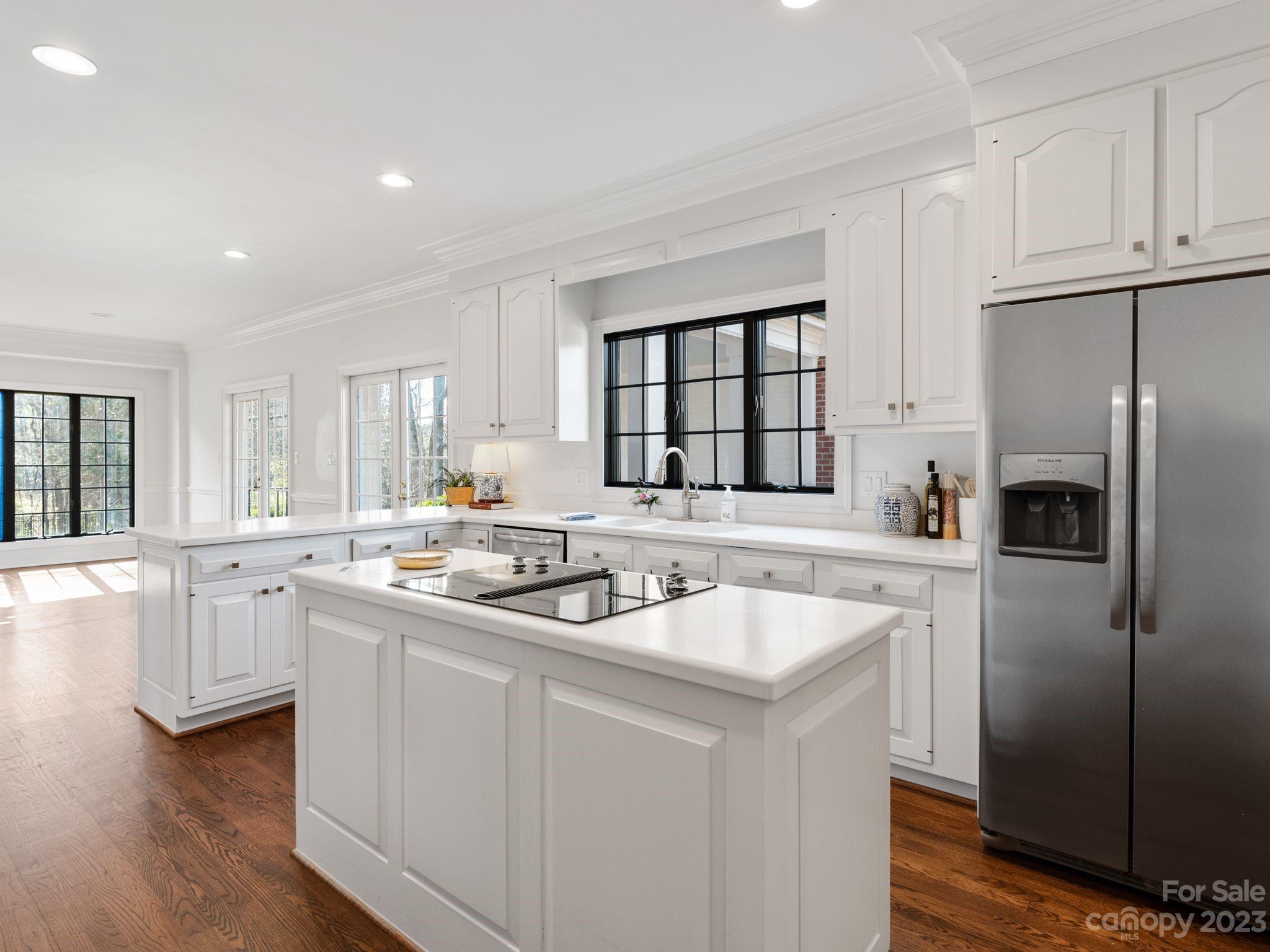 1150 Concord Road Davidson, NC 28036 - Photo 18 of 39 a kitchen with stainless steel appliances granite countertop a sink a stove and refrigerator