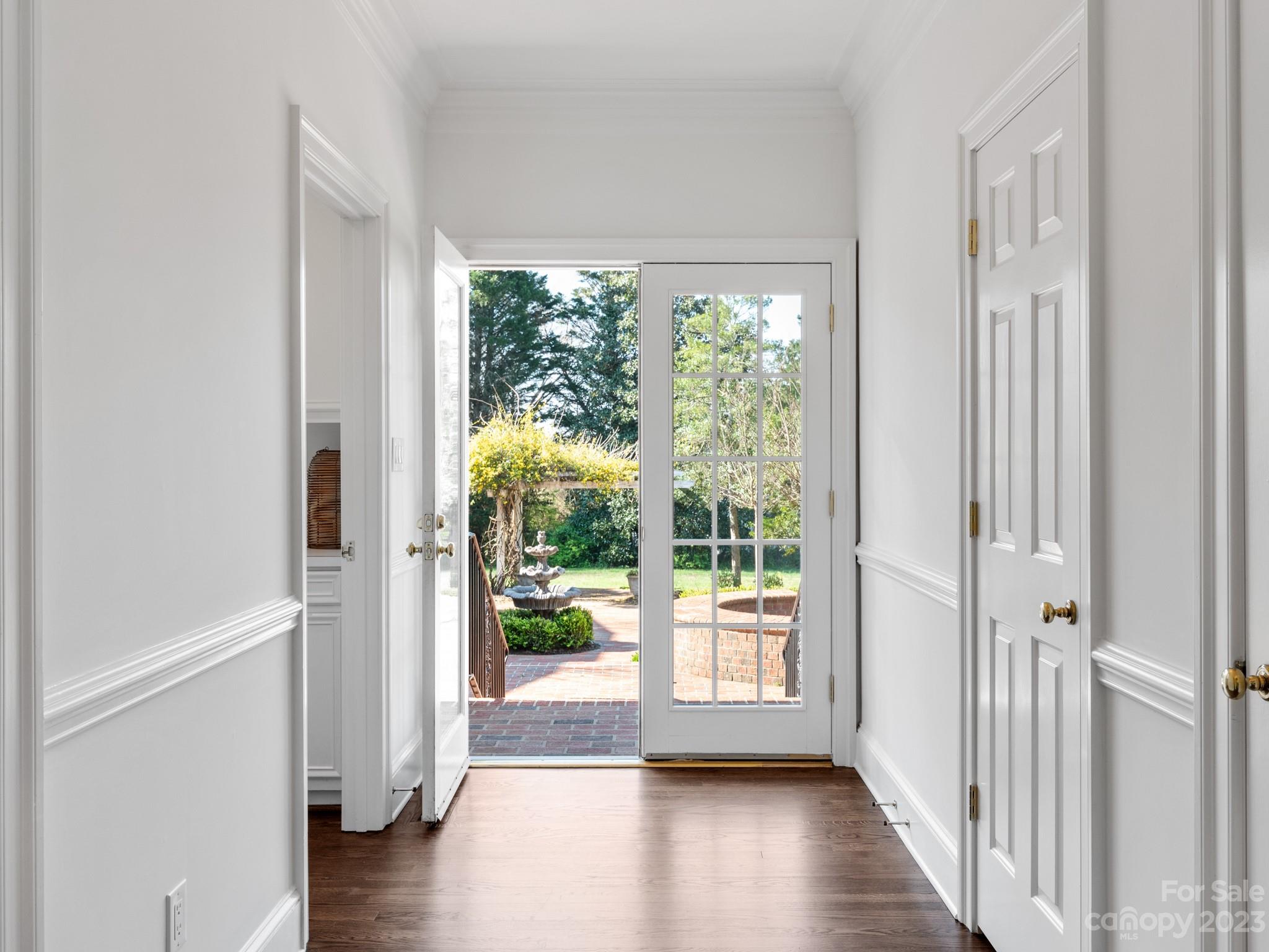 1150 Concord Road Davidson, NC 28036 - Photo 23 of 39 a view of a hallway with wooden floor and windows